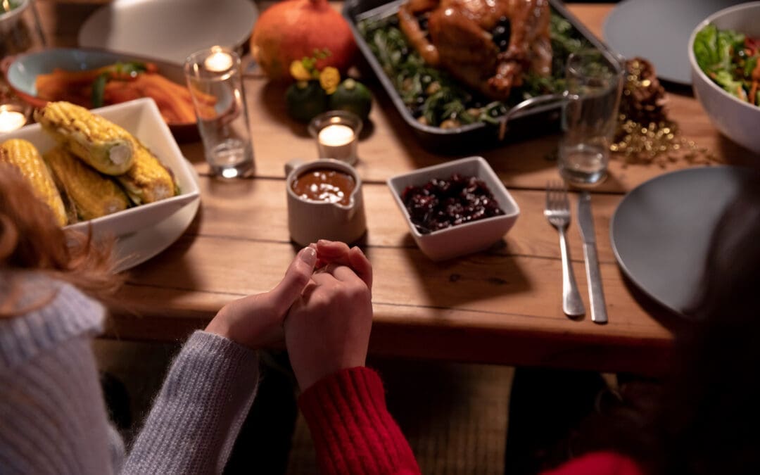 Millennial adult friends celebrating Thanksgiving together at home