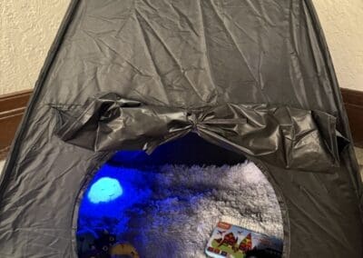 Sensory tent with furry rug, sensory cloud light, headphones, and fidgets at First Meridian Heights Church